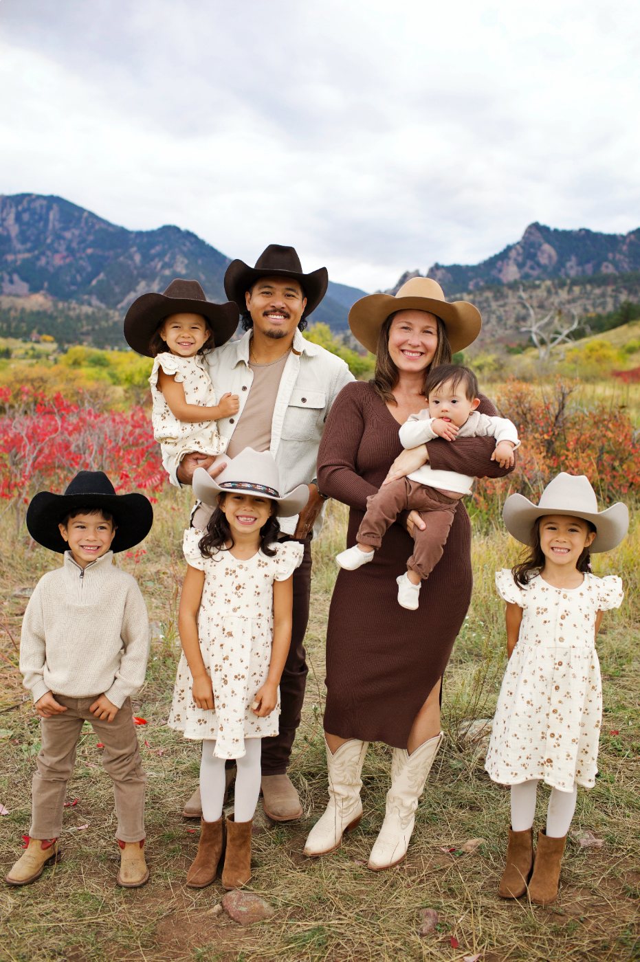 Andrew and Blaire Maliwat with their five children in cowboy hats